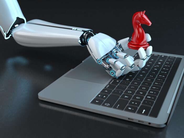A robotic hand holding a chess piece symbolizing the struggle of AI-enhanced phishing and cybersecurity.